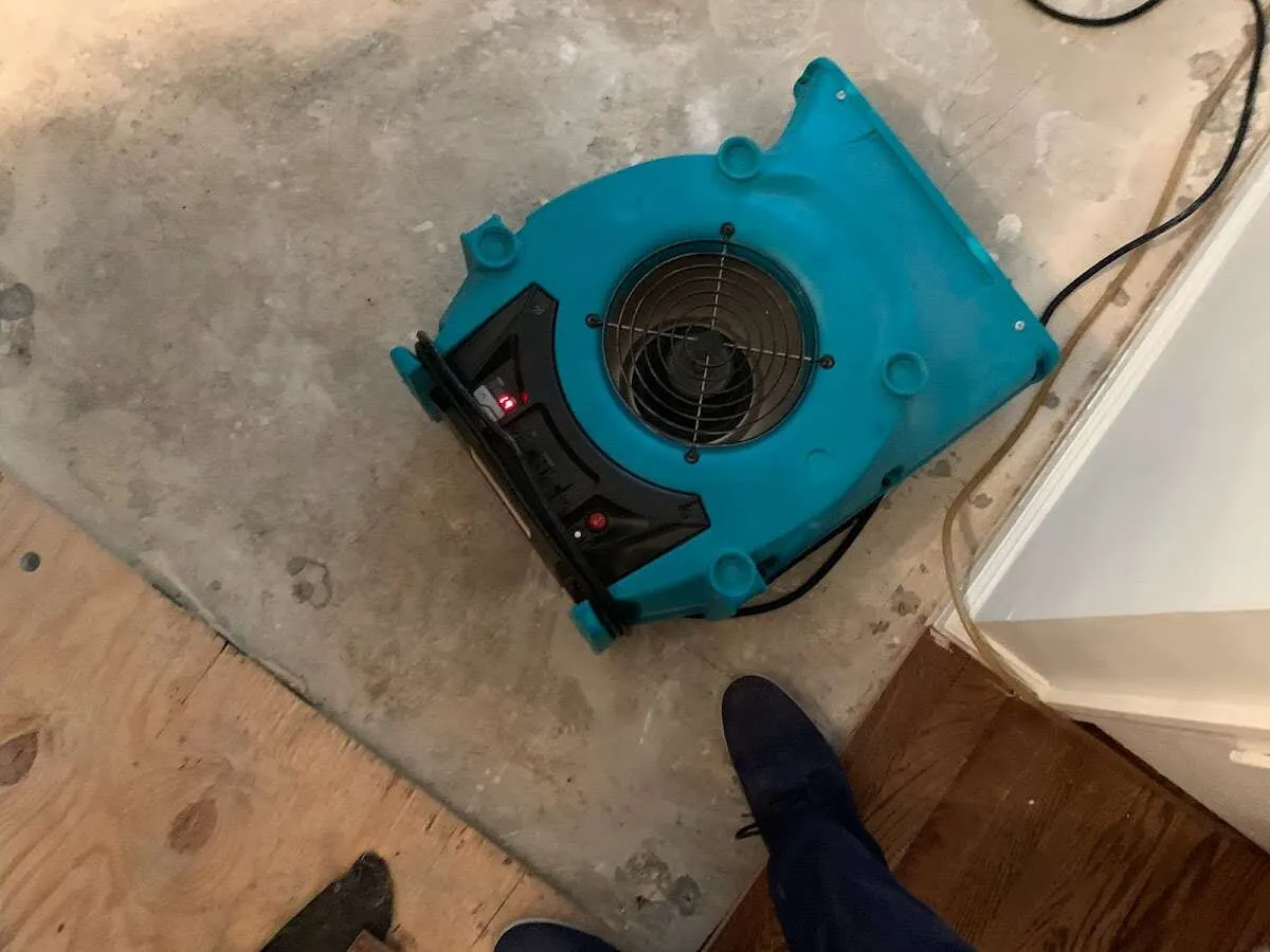 Air mover drying subfloor during Commercial Water Damage Restoration in Stone Ridge